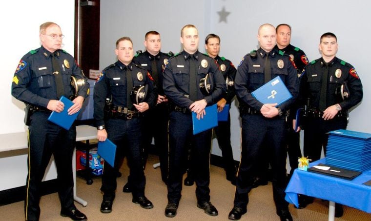 Nine officers receive award for saving a life after triple