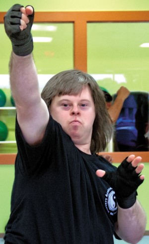 Dedicated Longview man earns Kung Fu black belt 12 years after graveside vow