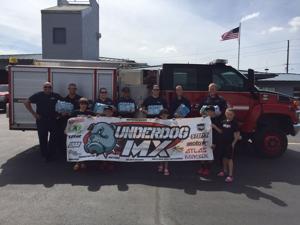 Motocross team donates 80 cases of water to firefighters