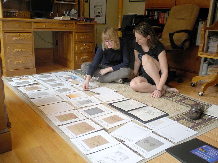 Lisa Soland and Karah D. Tull work on their book,