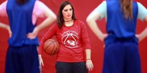 Shooting For The Stars: Heartland Lutheran girls basketball coach Kathryn Langrehr works with her team in the school's gym. Langrehr is organizing a charity game on Jan. 14 to raise money for stillbirths and neonatal deaths. (Independent/Barrett Stinson) - Barrett Stinson