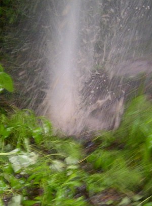 Geyser spouts water near the Guindon K 706 well pad.