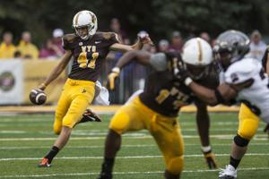 Wyoming punter Ethan Wood finds escape, meaning in football after parents' tragic deaths