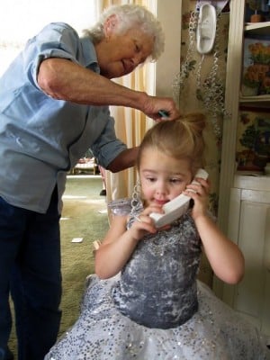 Krysta talks with her mom on the phone while her great-grandmother, Peggy Jensen, styles her hair before a performance of ‘The Nutcracker’ on Saturday in Lander  Read more: http://trib.com/news/state-and-regional/legally-blind-wyoming-girl-dances-in-the-nutcracker/article_724f7e96-3d7e-5214-9759-62ed489c4f72.html#ixzz1gFsARLKH