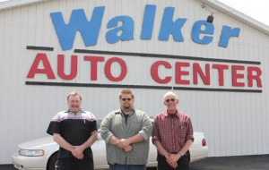 Gil Miller (center) is welcomed by owner Norm Wolf (left) and service and parts manager Ken Hopen. 