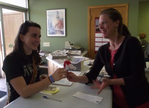 Diane Chmielewski, general manager of The Pilot-Independent, gave a donation to WHA freshman Sarah Anderson.
