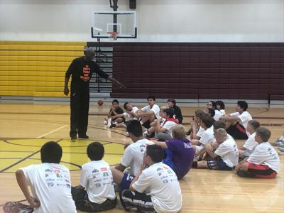 Los Angeles Lakers Legend Michael Cooper Uses Basketball Camp In