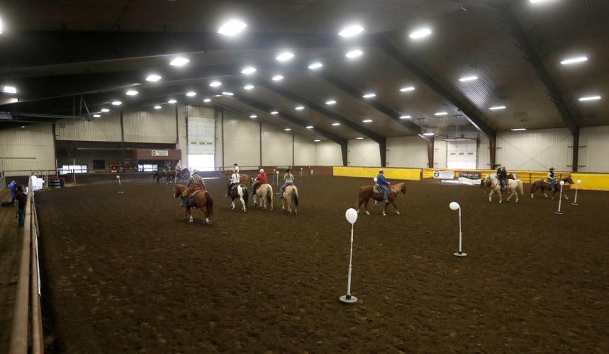 Horseback riders get hooked on cowboy mounted shooting at equestrian