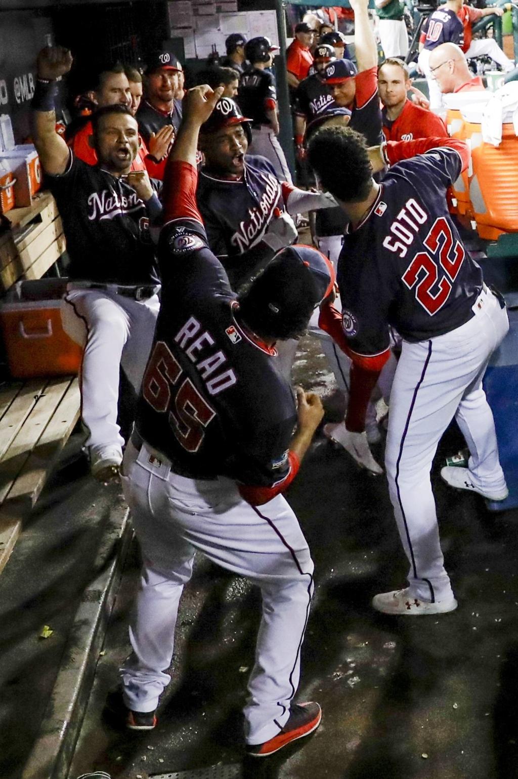 Photo: Nats' Juan Soto smiles from dugout during NLDS Game 4