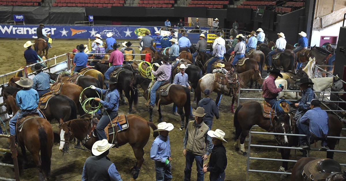 Team ropers compete in the Wrangler Roping Finals