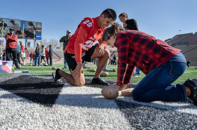 Photos; Project Heart Start teaches hundreds CPR at UNM stadium Local