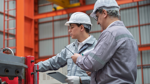Two workers in a factory