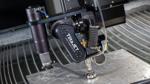 A closeup of a waterjet cutting metal.