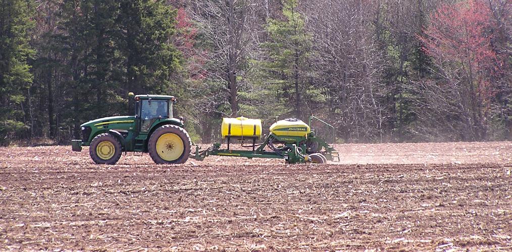 Tractor in field with planter