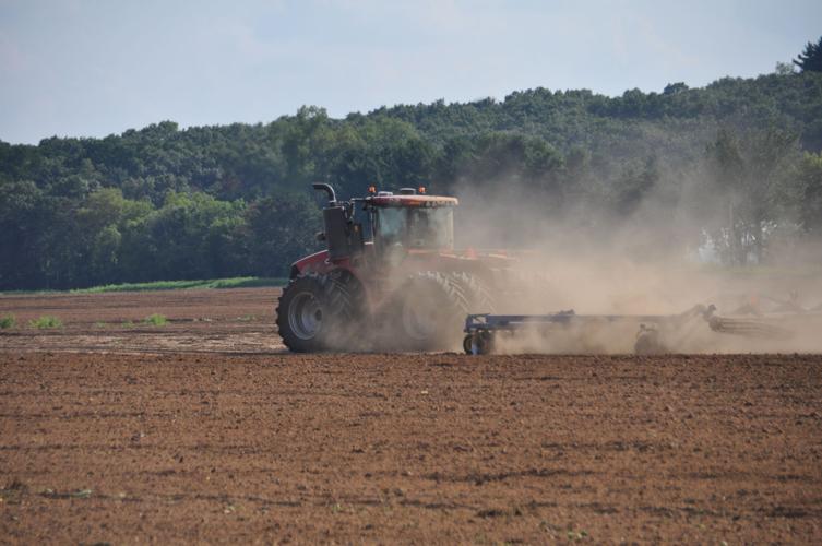 Working field with tractor