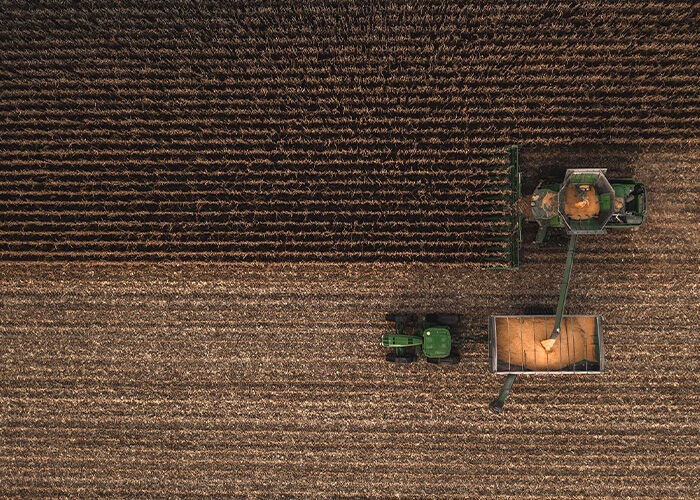 Tractor harvesting aerial view