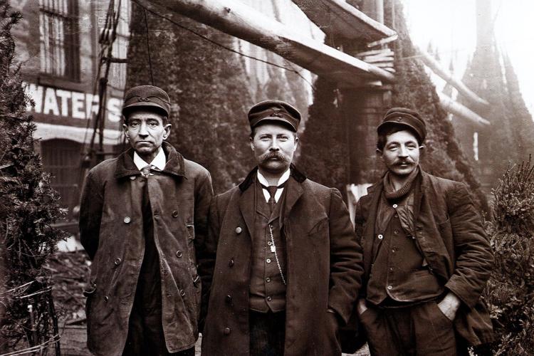 Captain Herman Schuenemann, center, Mr. Colberg, right, and W. L. Vanaman, left
