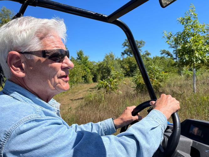 Parker-driving-through-land