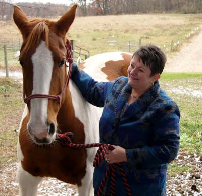 Kristi Schumacher spends time with her horse