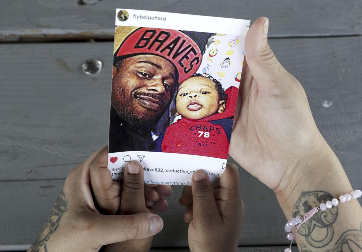 Jessica Marias, JaMichael Meaderds holding photo