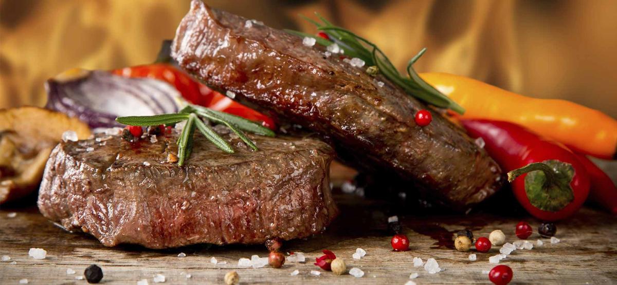 Pair of steaks with peppers