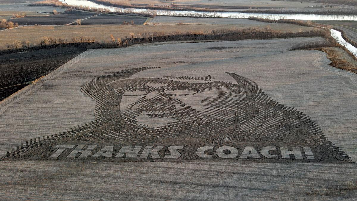 image of Kansas City Chiefs coach Andy Reid in soybean field