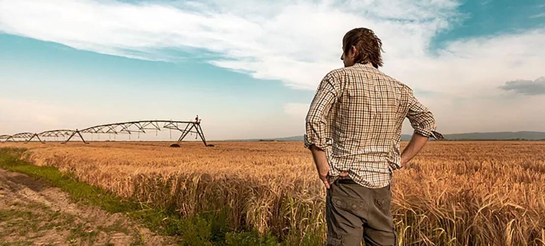 Worried farmer in field