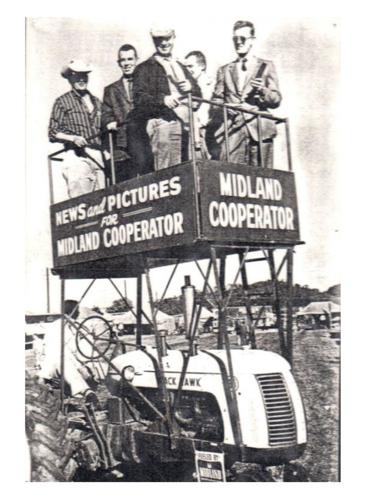 'Life' magazine photographers stand on a platform built with support from Midland Coop at the 1957 Wisconsin Farm Progress Days in Juneau County.