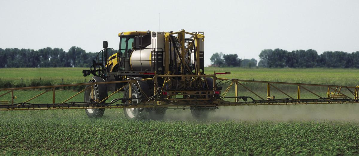Pesticide applicator in field