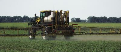 Pesticide applicator in field