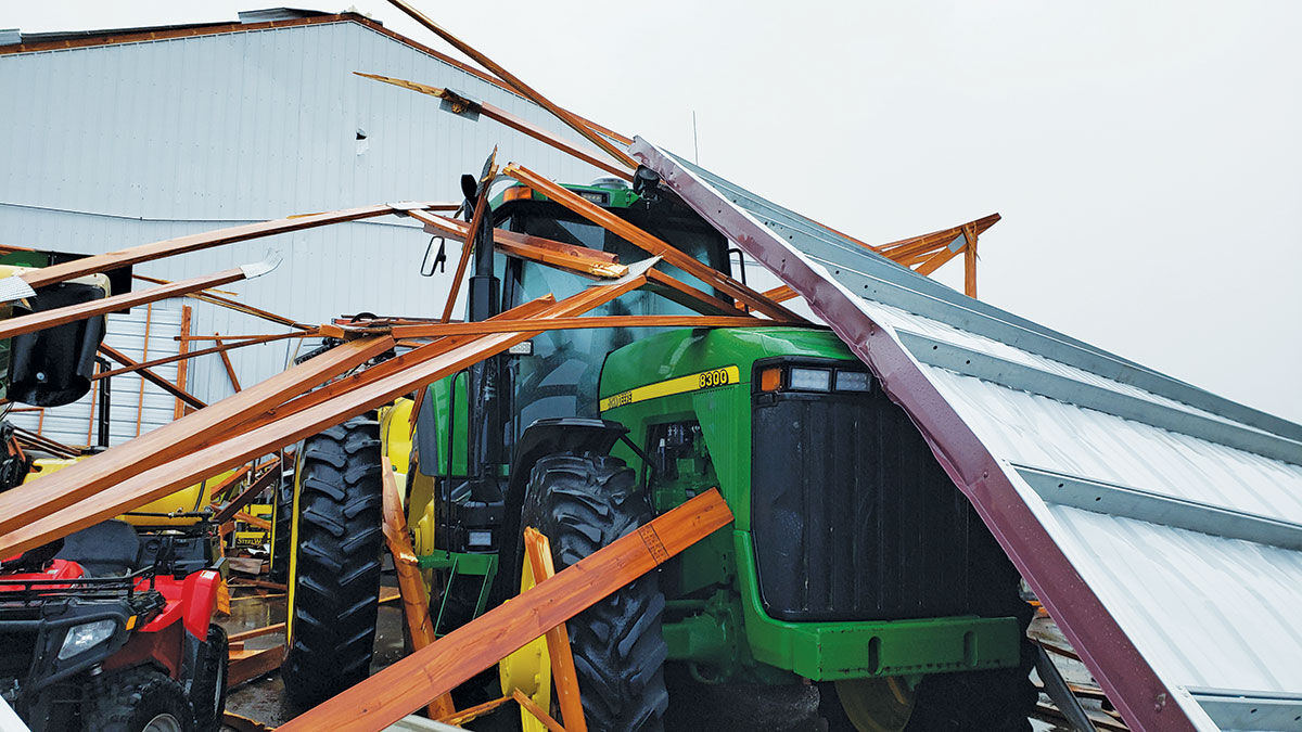 tractor is covered in debris from the derecho