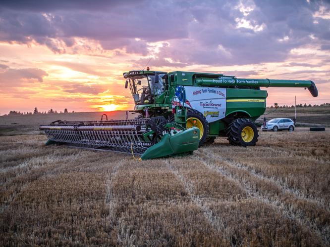Farm Rescue gooseneck combine sunset
