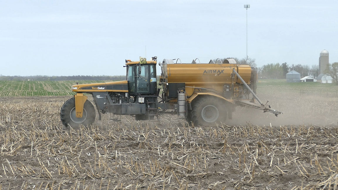 Sprayer in field for early fertilizer application