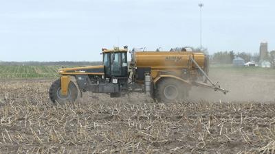 Sprayer in field for early fertilizer application