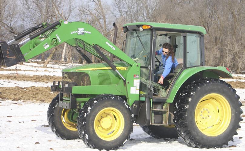 Rachel Bouressa in tractor