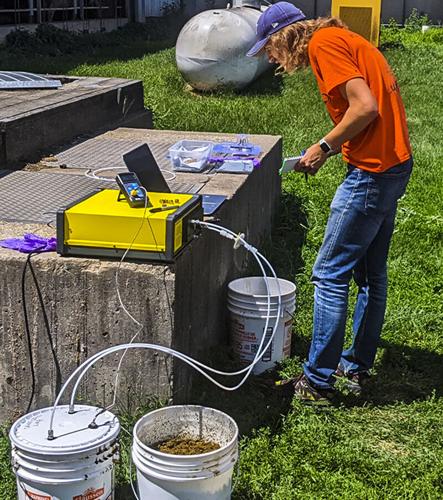 Zach Flitsch tests analyzer for biochar study
