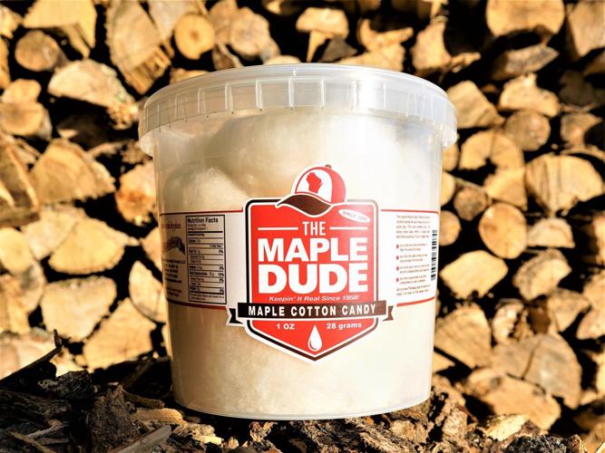 Maple cotton candy with woodpile behind