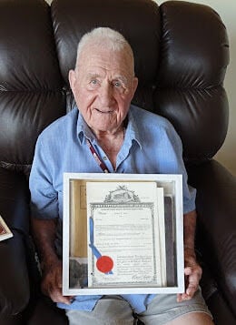 PHOTO 3 - Harvey Bish holding patent.jpg