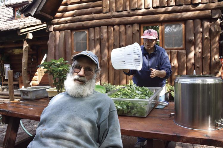 Joe and Mary Hovel tend vegetables