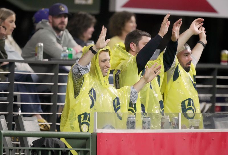 Despite the roof being closed, fans don rain ponchos in centerfield during the eighth inning of the Milwaukee Brewers game against the Toronto Blue Jays Wednesday, April 15, 2026 at American Family Field in Milwaukee, Wisconsin.