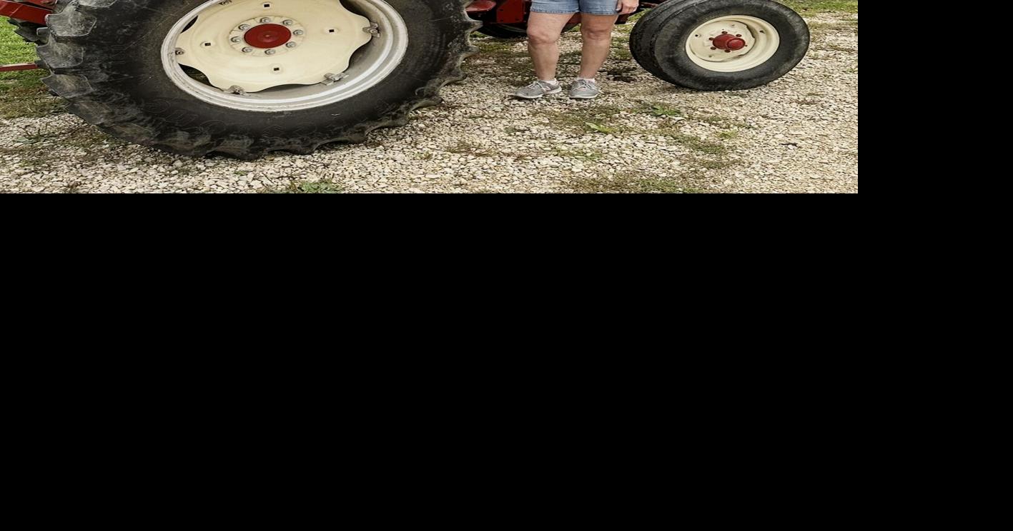 Sarah Pfaff-Cavadini with her father's tractor