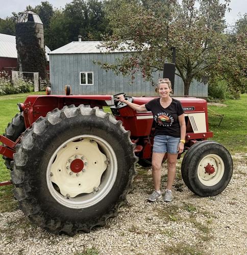 Sarah Pfaff-Cavadini with her father's tractor