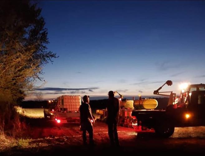 Jeff and Jim Gibson talking in the field