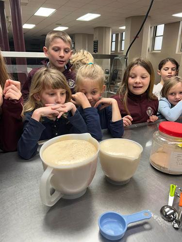 students watch bread dough rise
