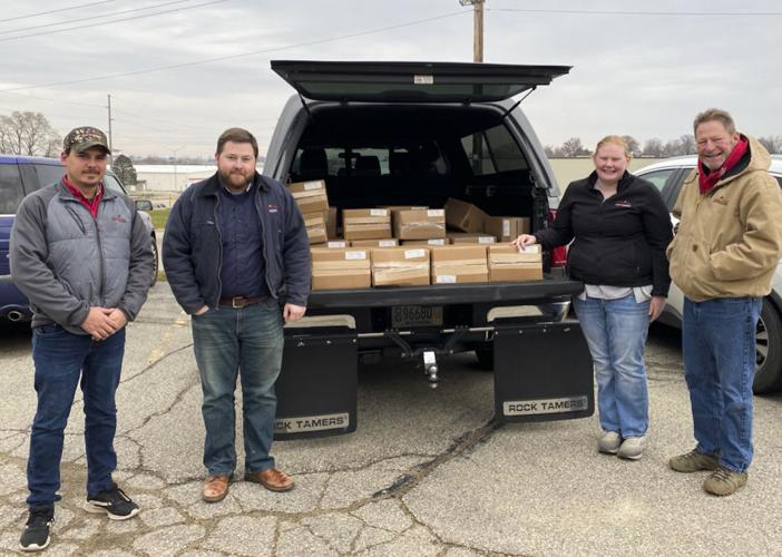 Rolling Hills Dairy Producers Cooperative staff with cheese donations