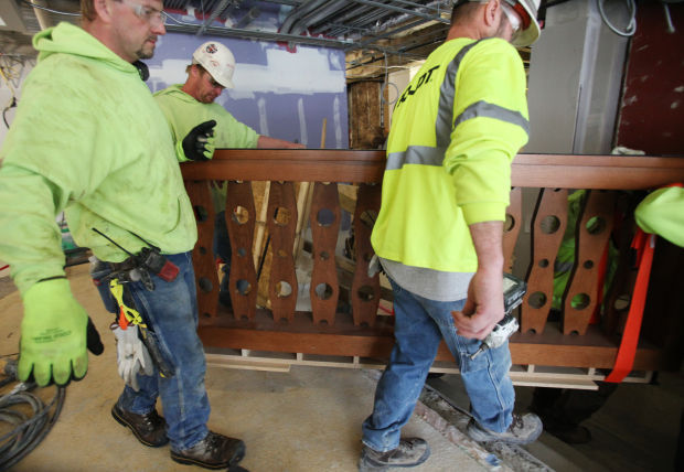 Workers carrying bar image (copy) (copy) (copy)
