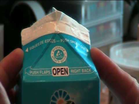 Carton of milk being opened