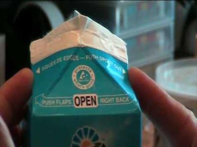 Carton of milk being opened