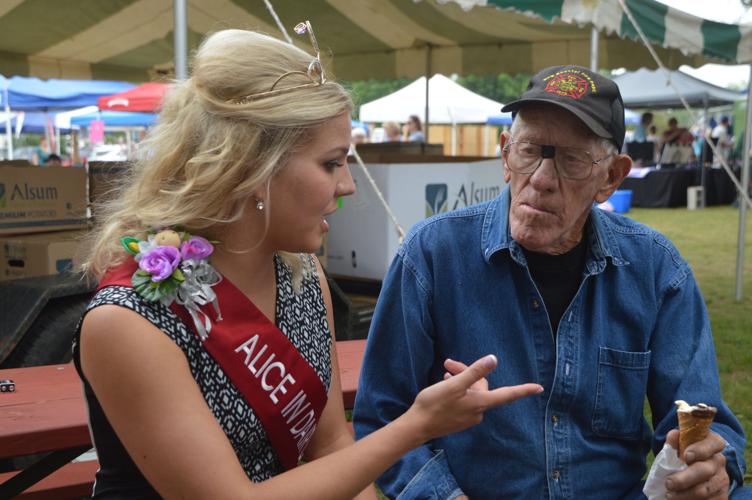 Crystal Siemers-Peterman, Alice in Dairyland, talks with of the founders of the Corn 'n Tater Festival, Harold Wolfert.