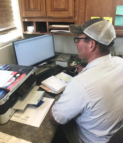 Andy Fisher reviewing pen counts